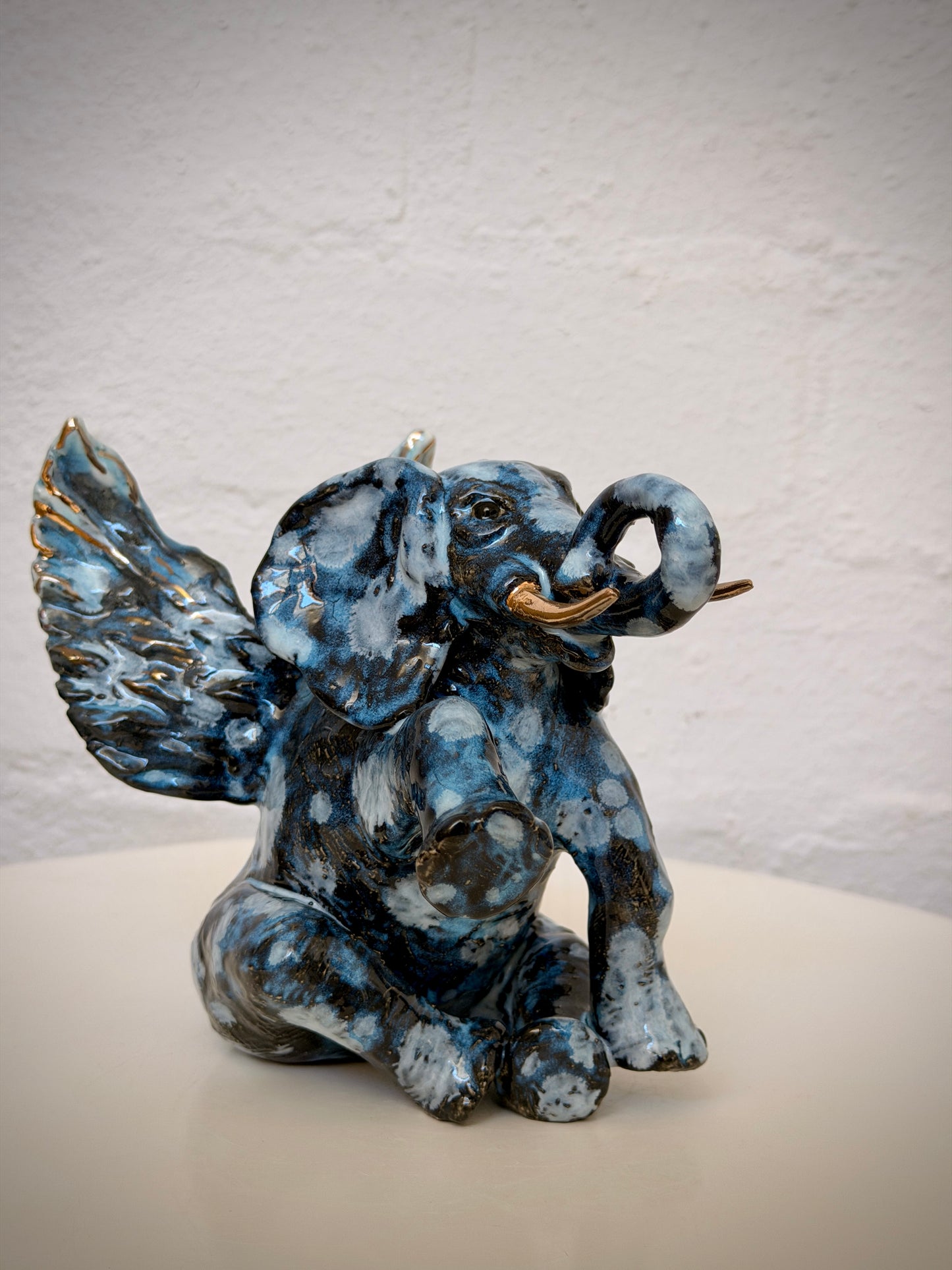 Winged sitting elephant