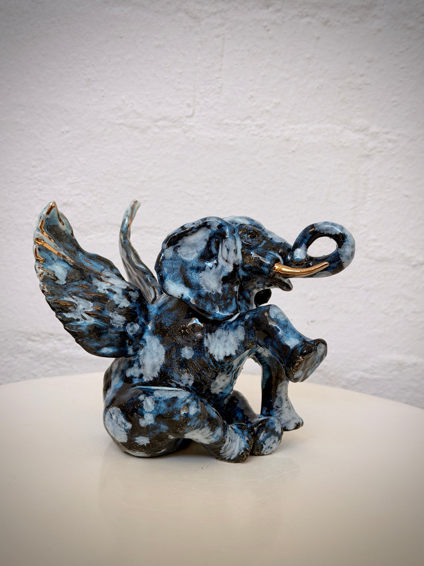 Winged sitting elephant