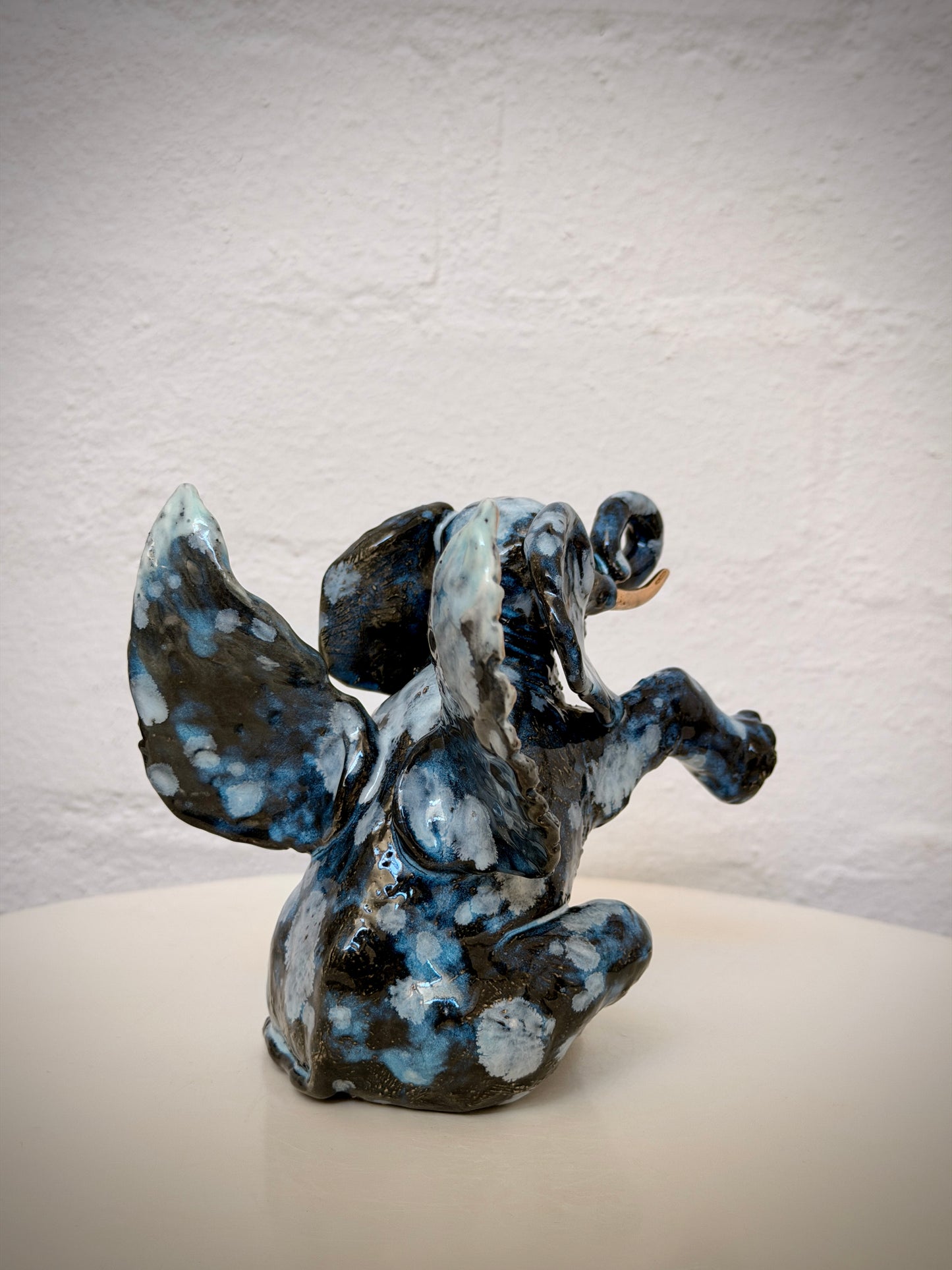 Winged sitting elephant