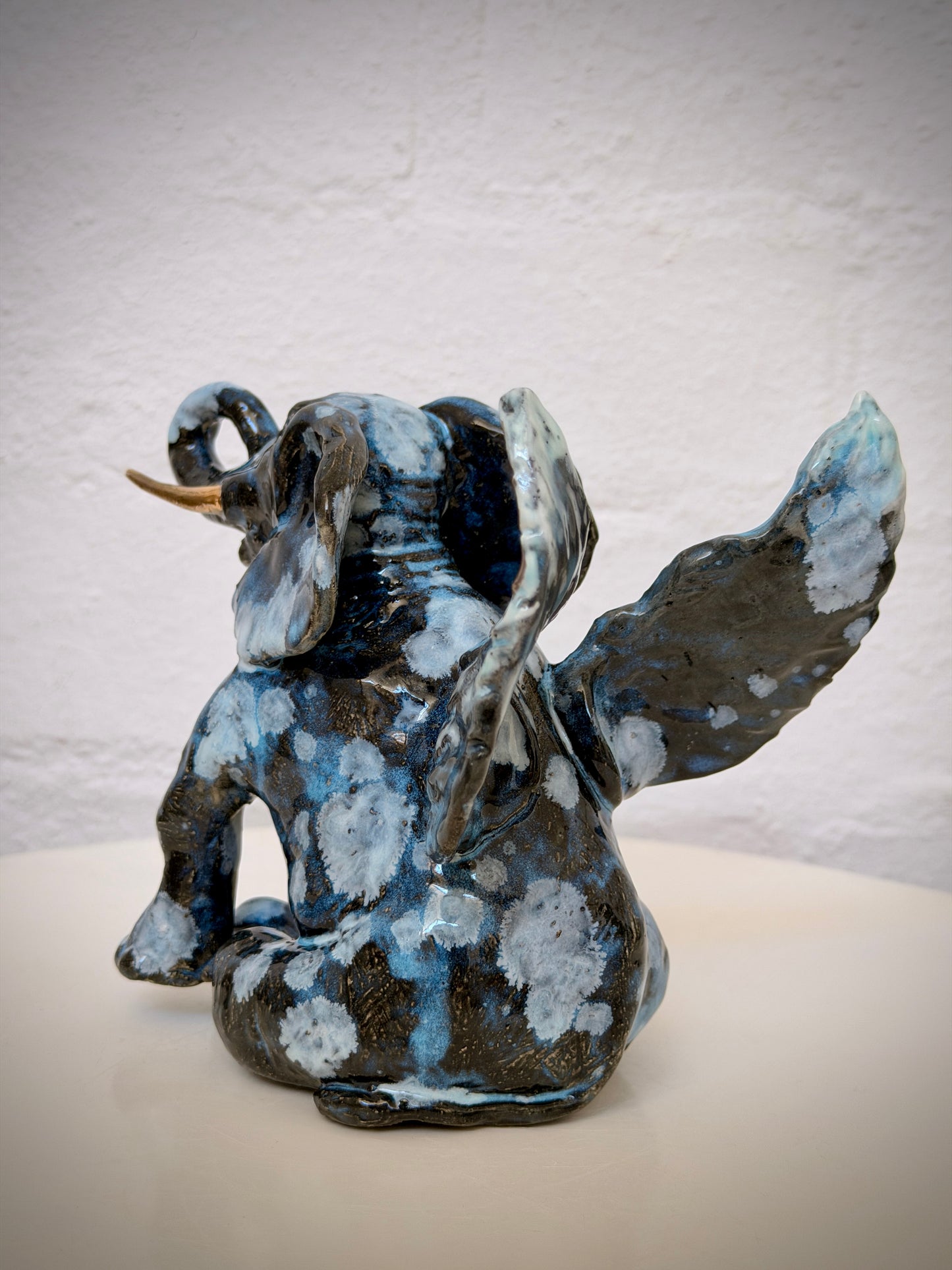 Winged sitting elephant
