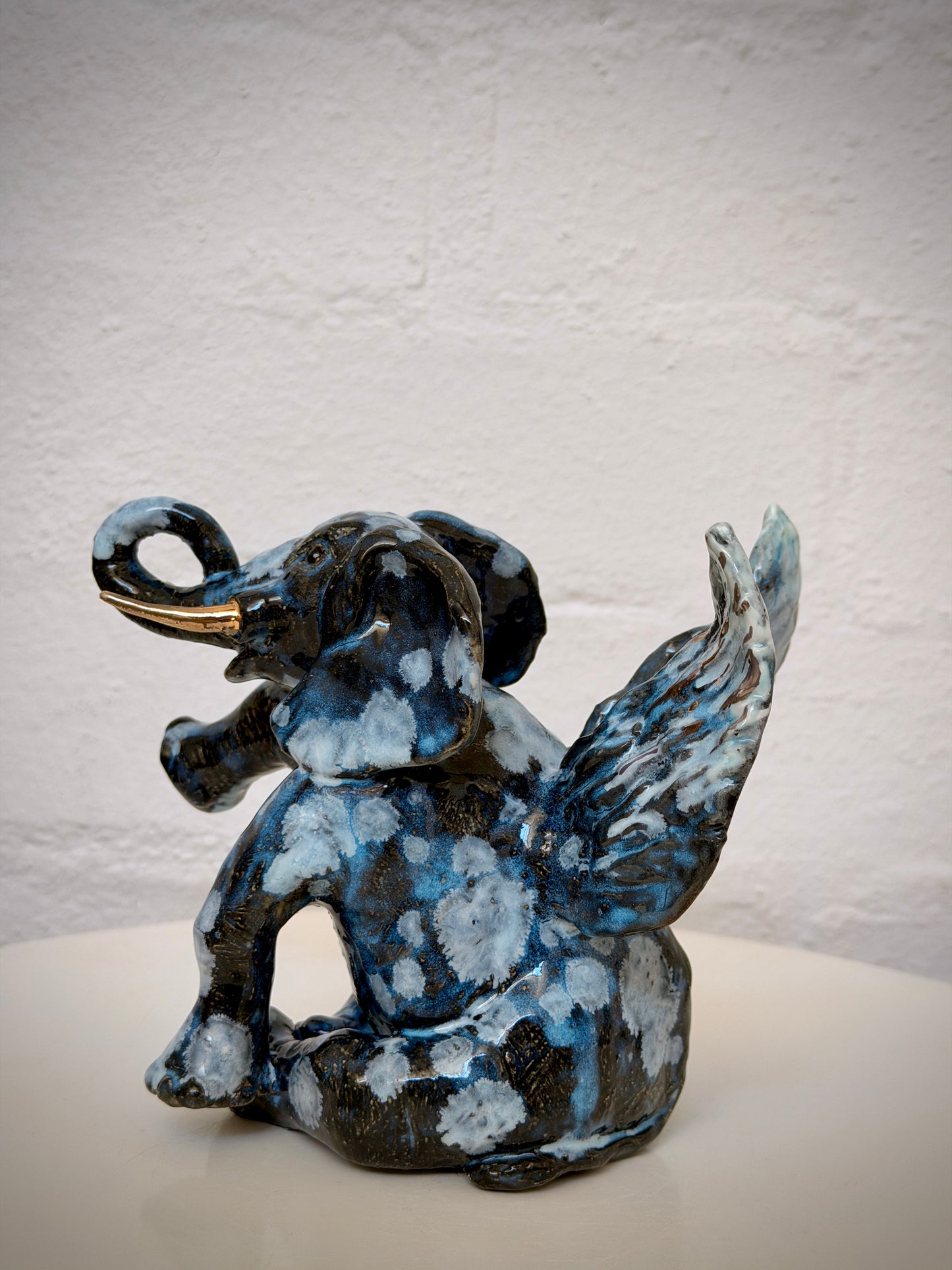 Winged sitting elephant