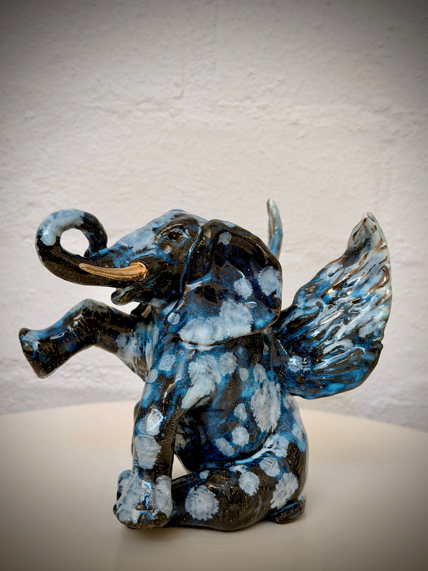 Winged sitting elephant