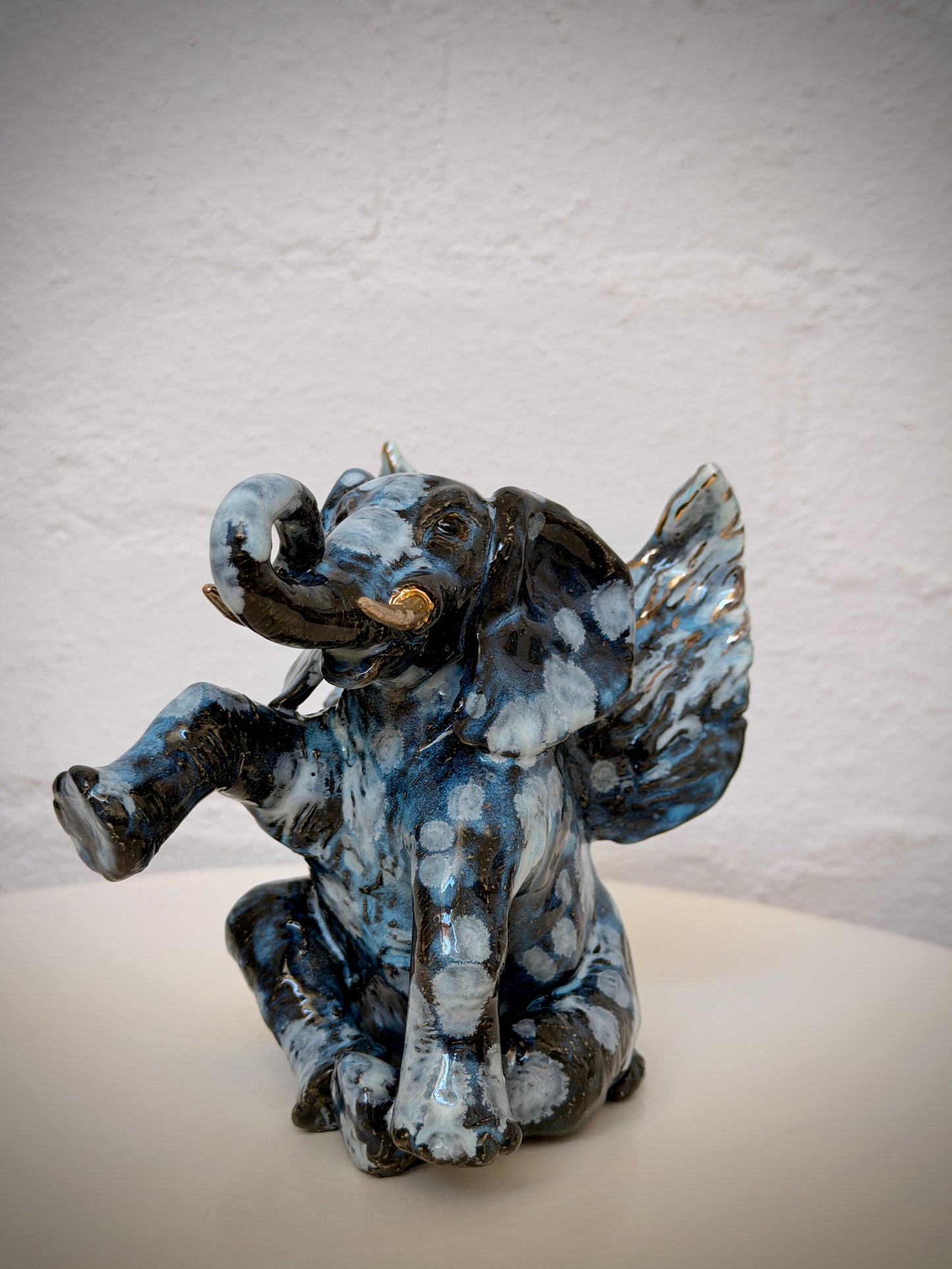 Winged sitting elephant