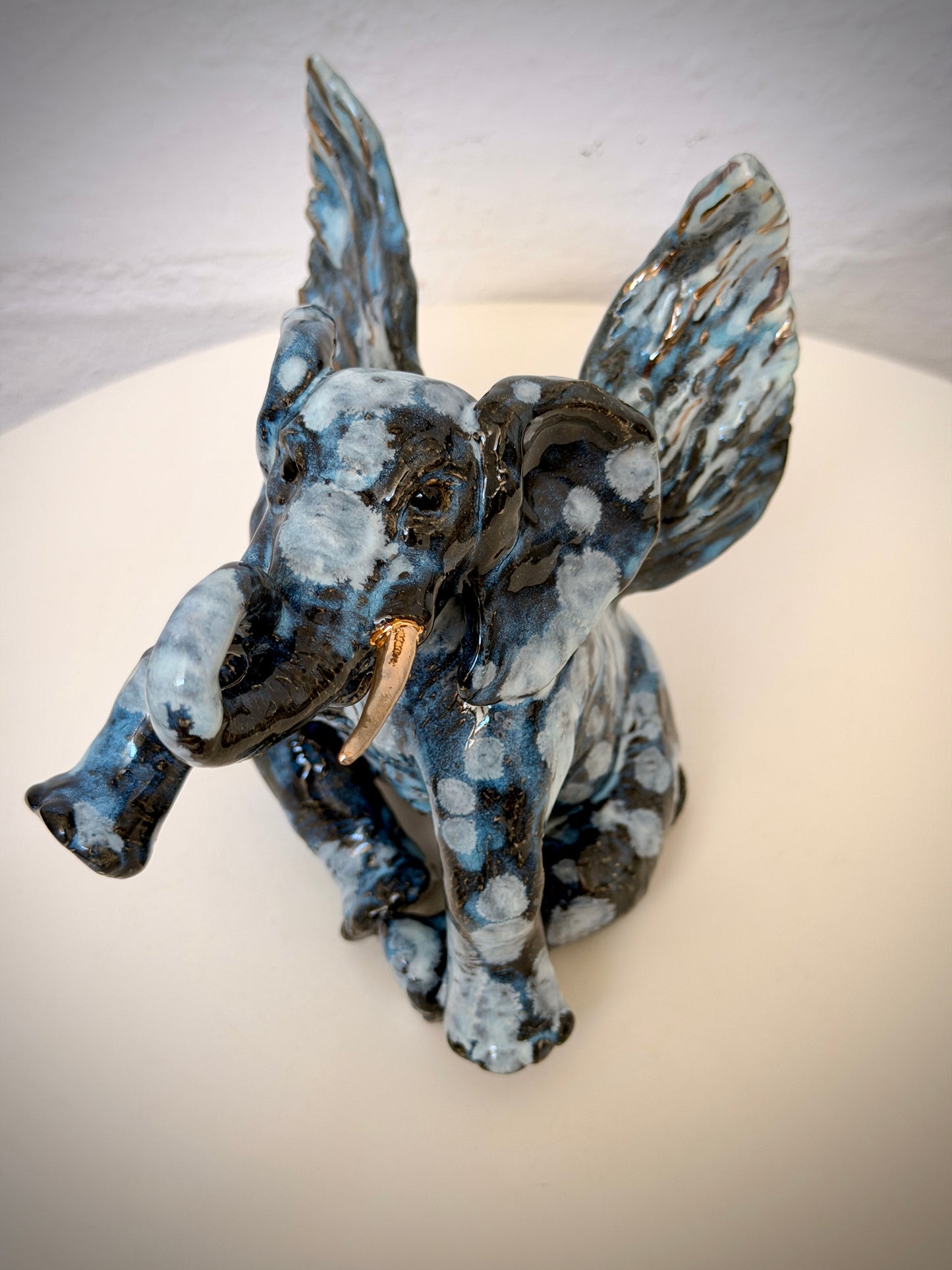 Winged sitting elephant