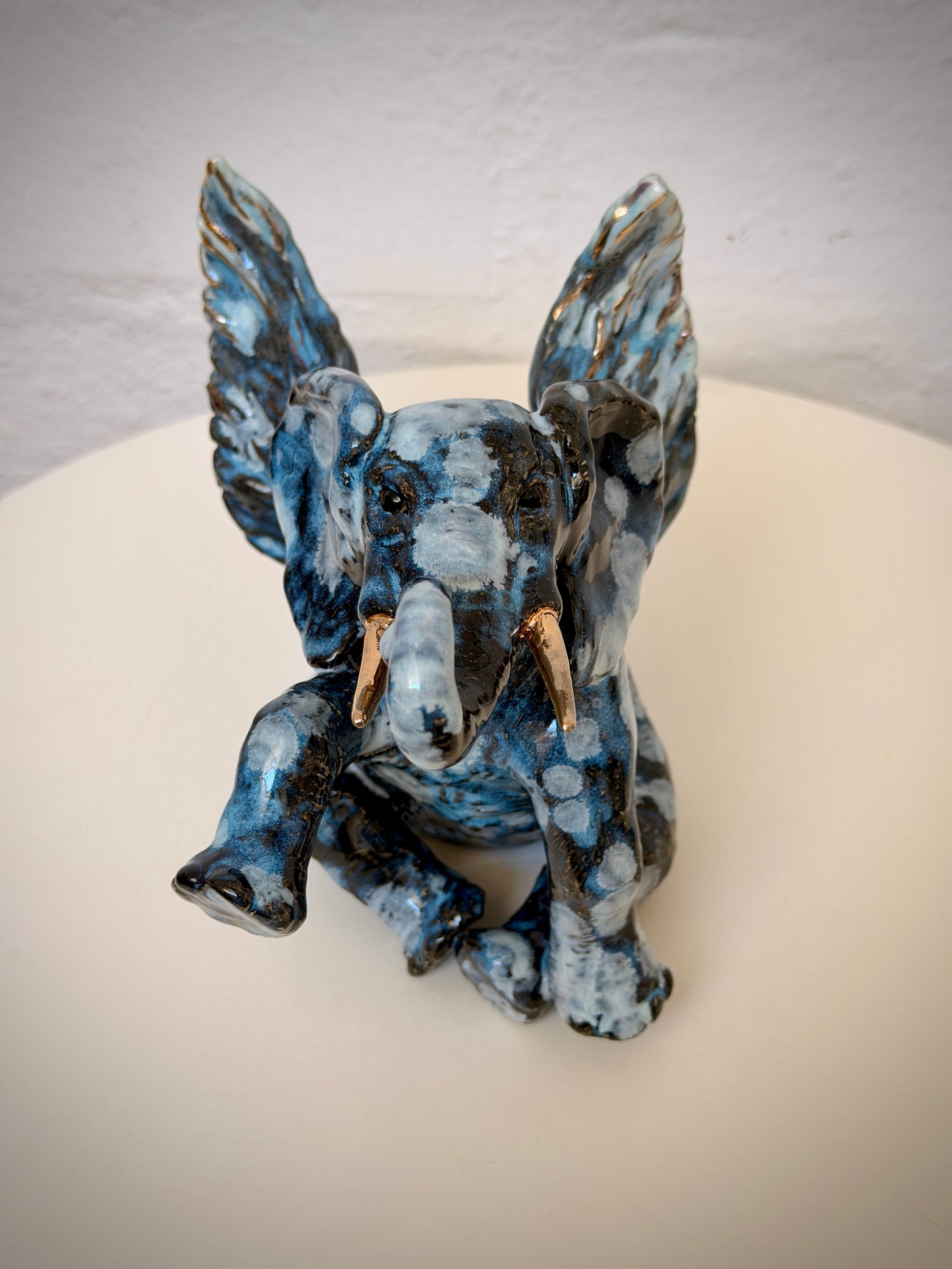 Winged sitting elephant